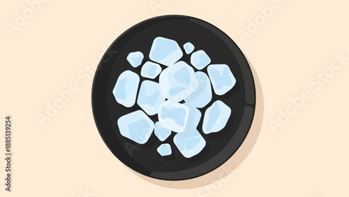 A dark plate holds a pile of translucent blue ice cubes on a beige background