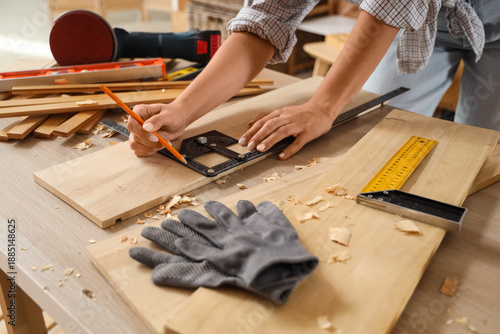 Young female carpenter with...