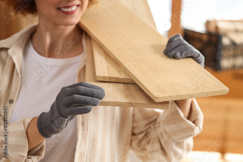 Young female carpenter with...