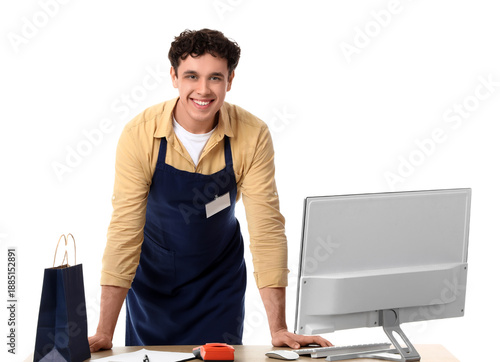 Young male cashier with sho...