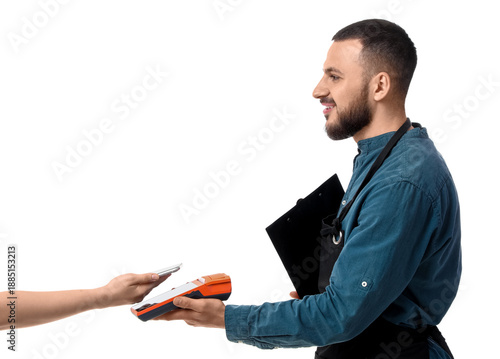 Young male cashier receivin...