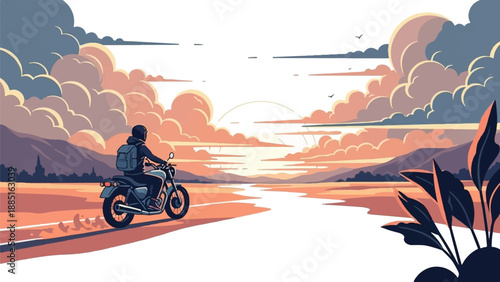 A lone biker rides a motorcycle along a road during a beautiful sunset