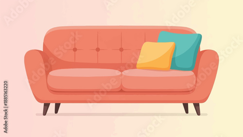 A plush coral sofa with two colorful pillows rests indoors