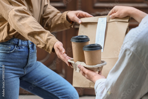 Woman receiving order from ...