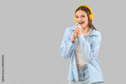 Young woman in headphones w...
