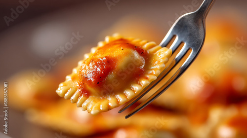 Square ravioli with red sauce on a fork, detailed texture, shallow depth of field