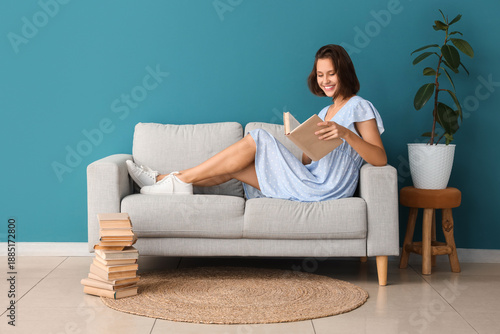 Pretty young woman reading ...
