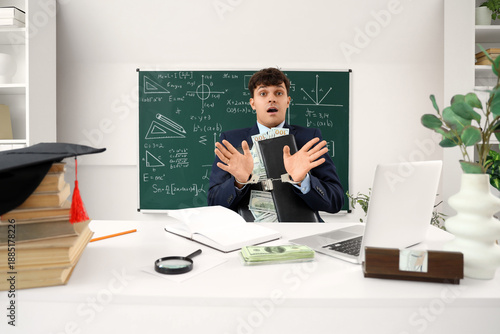 Handcuffed male teacher wit...