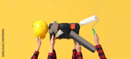 Hands with hardhat and diff...