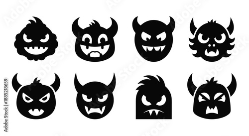A set of eight black silhouette icons of monster and devil faces with angry and mischievous expressions horns and sharp teeth.