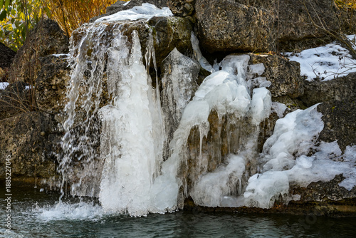 An artificial waterfall. In harsh winters, the falling water freezes and forms impressive ice formations.