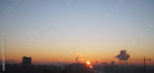 View of the snow-covered skyline of city at sunrise with sky
