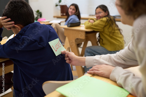 Photography Group of multiethnic teenagers sitting in classroom, Caucasian teenage girl secr