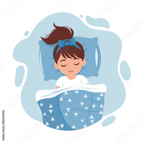 Young girl sleeping peacefully under blue blanket with patterns  
