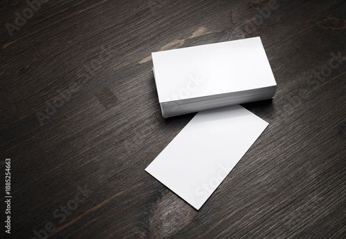 Blank business cards template on wooden surface. Template for graphic designers portfolios.