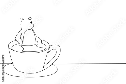 One line drawing of playful brown bear shows cute animal soaking in coffee cup for nature concept. Unique design features grizzly for an international cafe day theme in a minimalist style