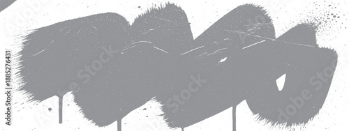 Abstract gray spray paint stroke with drips on white background.