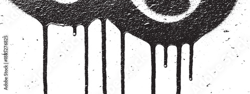 Black graffiti spray paint drips on a white wall.