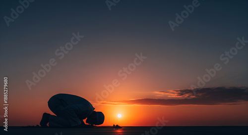 Silhouette of Muslim Man Performing Sujud Prayer at Golden Sunset Horizon