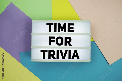 Konstfotografi Time For Trivia text in lightbox flat lay on colorful pastel background