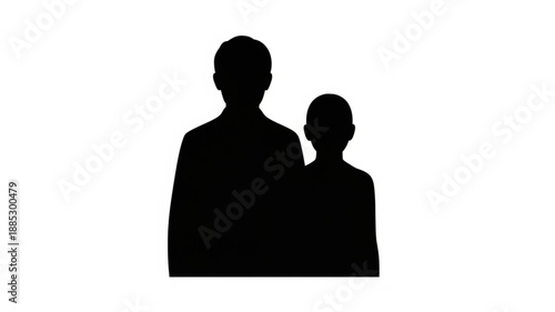 Silhouette of a man and a child standing together.