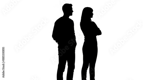 Silhouette of a couple standing apart with arms crossed.