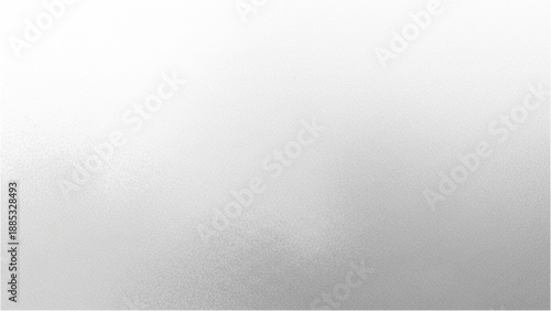 Foggy landscape with mountains, trees, and misty atmosphere viewed from a distance.