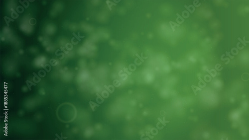 Soft green bokeh light particles on blurred background