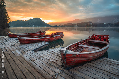 Quadro em tela Boat at lake Bled in Slovenia at Sunset