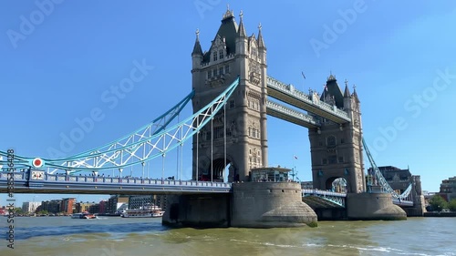 Wide riverside view of Tower Bridge and the Thames on a sunny day in London, UK