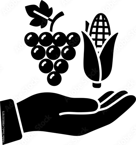 Hand holding grapes and corn. Thanksgiving or harvest festival concept. Flat design. Black glyph icon for web design, app, print