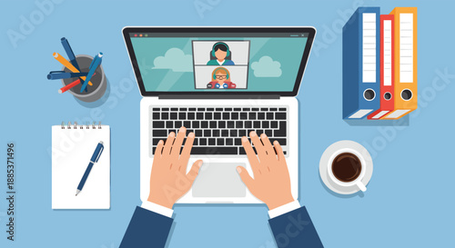 Overhead view of workspace with laptop showing video conference call between colleagues for remote team collaboration.