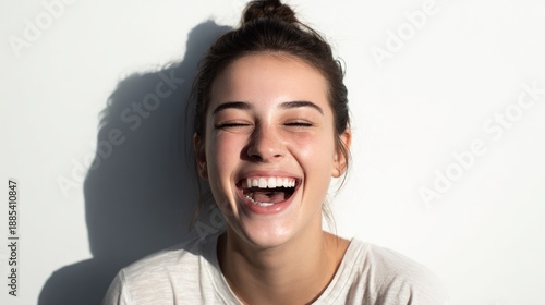 Authentic joy radiating from a young woman expressing uncontainable laughter