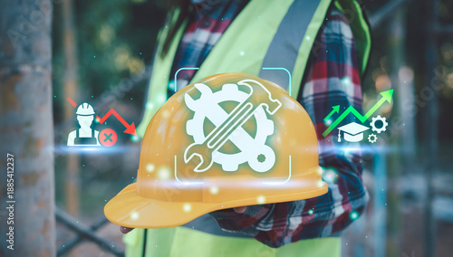 Φωτογραφία Construction worker holding yellow hard hat with digital icons representing labo