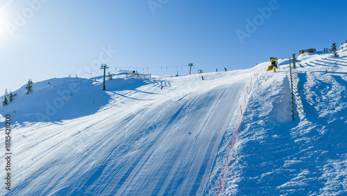 Canvastavla Alpine ski slopes intersecting across mountain terrain with visible chairlifts,