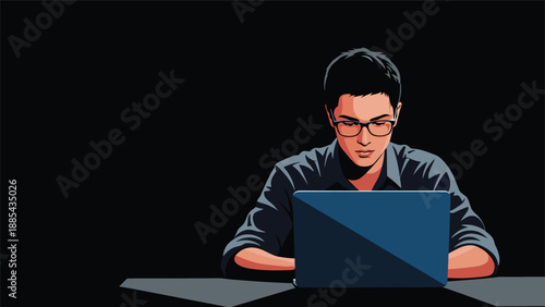 Focused young man with glasses works on his laptop computer at night in a dark room to complete an urgent programming task.