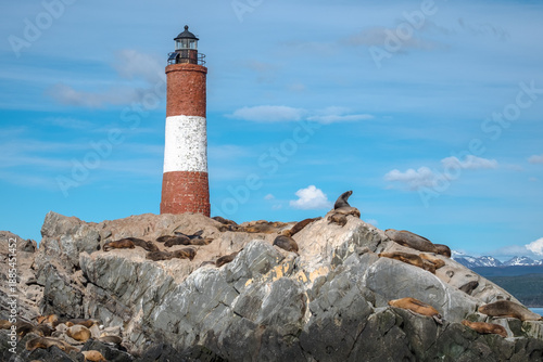 Faro Les Éclaireurs, a lighthouse on a rock island with many sea lions near Ushuaia, Argentina