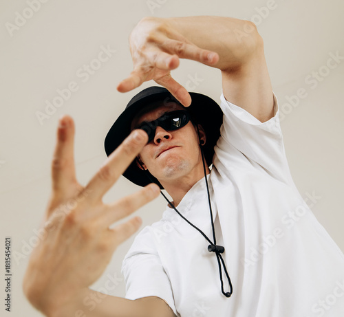 Картината върху платно Portraits of a stylish young male dancer showing expressive dance gestures