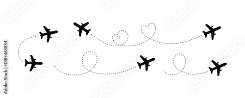 Set of flying airplane silhouettes with dotted flight paths, loops, and heart shape