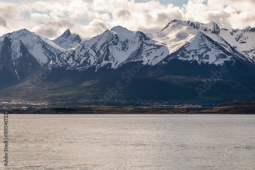The Beagle Channel, Ushuaia airport and snow covered mountains Cerro Seguí, Cerro Bridges and Cerro Martial, Argentina