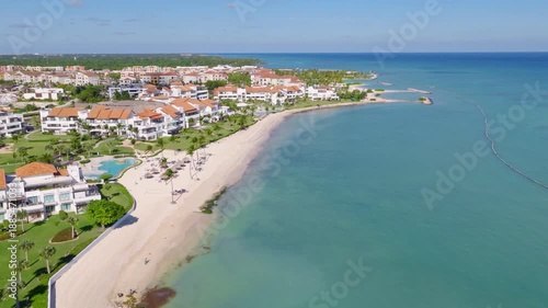 Wallpaper Mural Luxurious Cap Cana coastline. White sand beaches and villas meet the calm, turquoise Caribbean Sea. Ideal for high-end travel and real estate concepts, Dominican Republic. Aerial drone view Torontodigital.ca