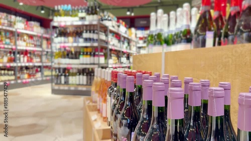 Wallpaper Mural defocused alcohol (wine, champagne, liquor, whiskey) on store shelves Torontodigital.ca