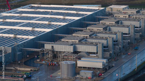Data center building featuring solar panels and advanced cooling systems