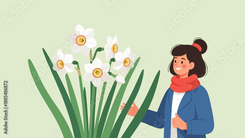 Cheerful person in blue coat and red scarf smiles near white daffodils