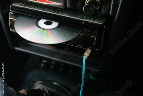close up of dvd player with disc on head unit audio car