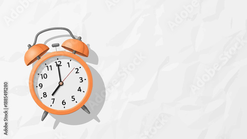 A vintage orange alarm clock rests on a textured white paper background