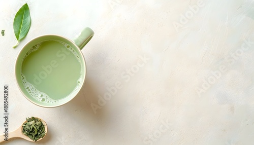 Matcha Green Tea Cup with Powder and Leaves on Neutral Background
