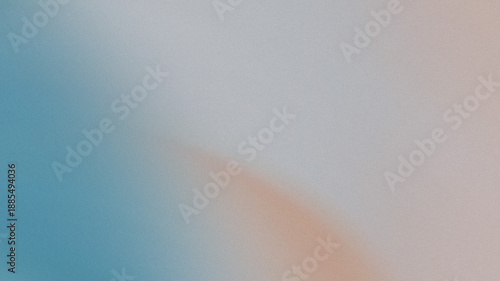 The soft and grainy abstract background featuring a diagonal color gradient from muted blue to light gray