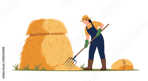 Female farmer in a yellow hat and blue overalls using a pitchfork to move a large pile of golden hay on a farm.