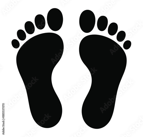 A pair of black footprints or bare feet on a white background, symbolizing walking, movement, travel, and human presence concept.